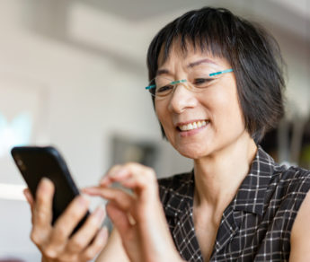 Senior Asian woman using a smartphone